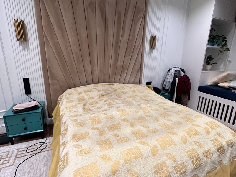 Upholstered bed with tall panel headboard in beige – ReNew Studio