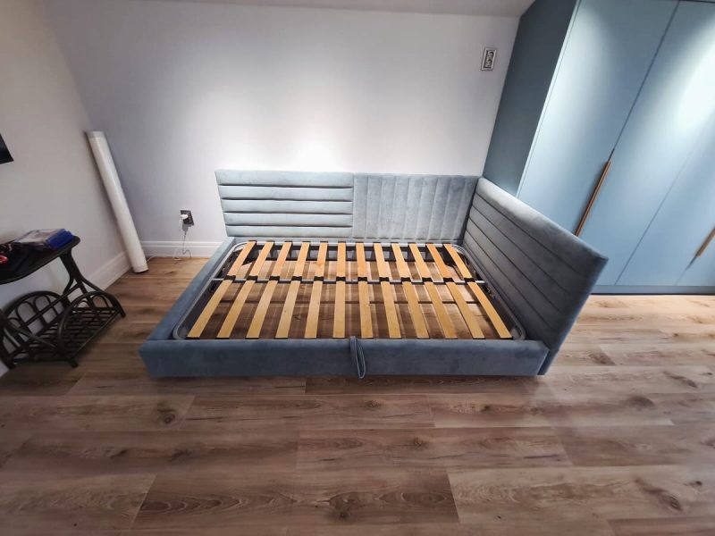 Upholstered bed with corner headboard – custom design by ReNew Studio
